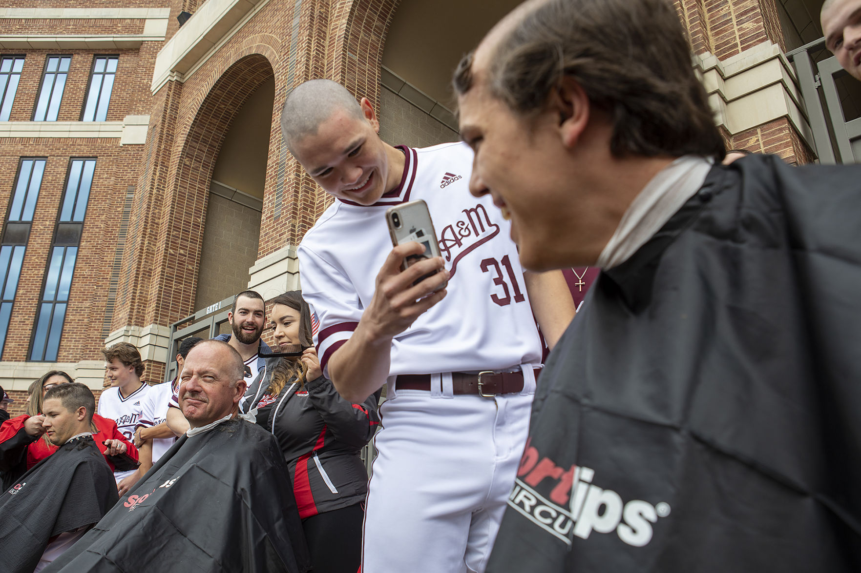 A&M baseball head shaving for cancer